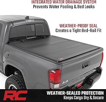 BAKFlip MX4 drain tube system with integrated rail channels